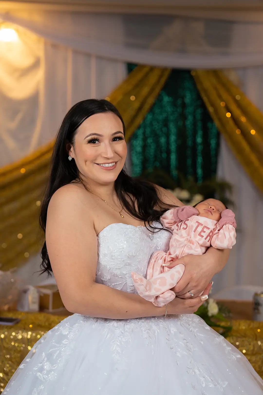 Bride holding baby at Washington wedding