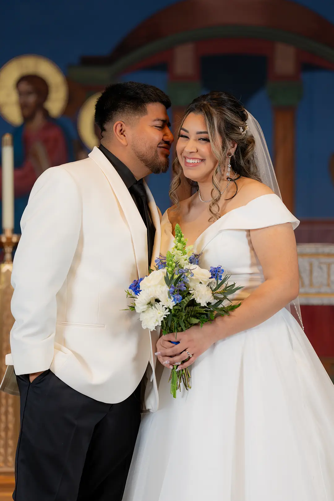 Groom and bride smiling on wedding day
